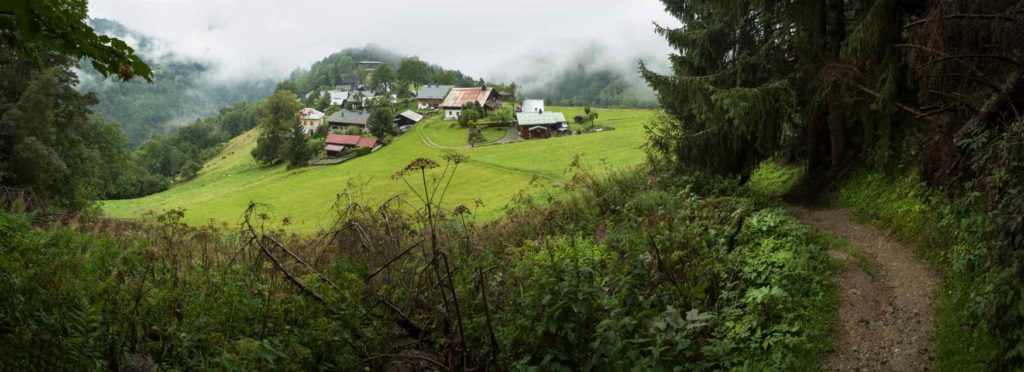 Village in green hills, Les Houcheas, France