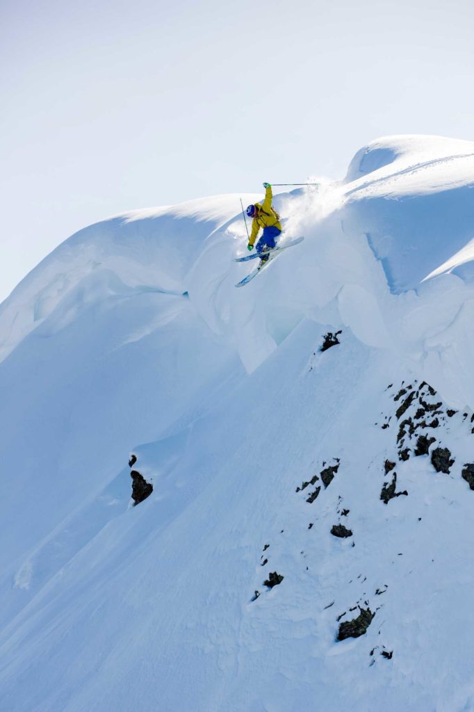 Austria, Tyrol, Alpbach, skier on a freeride jumping above snowdrift
